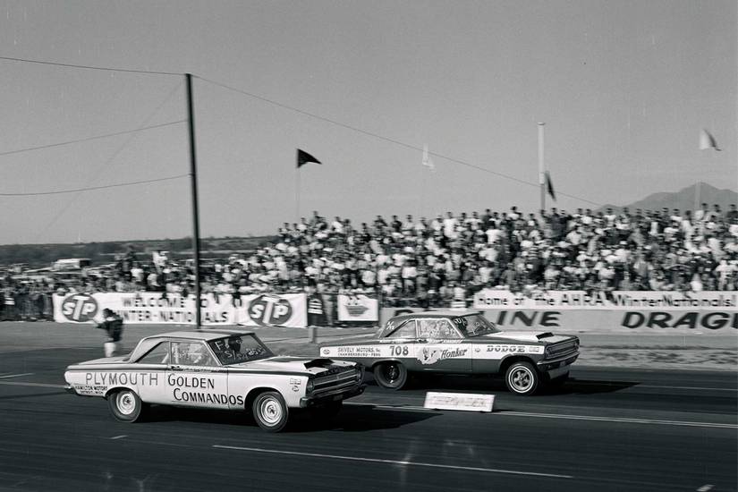 A NASCAR race in the 1960's between Chrysler/Dodge and Plymouth