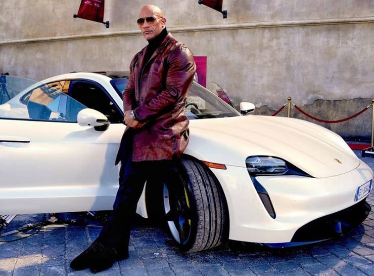 Netflix Crew Erupts In Laughter As The Rock Can't Squeeze Into Taycan Turbo S