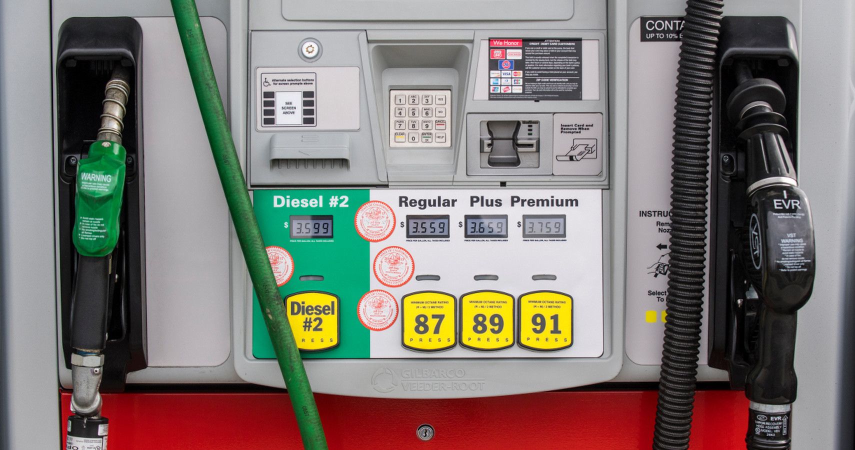 A petrol pump at a US filling station showing diesel and regular grade prices on the display