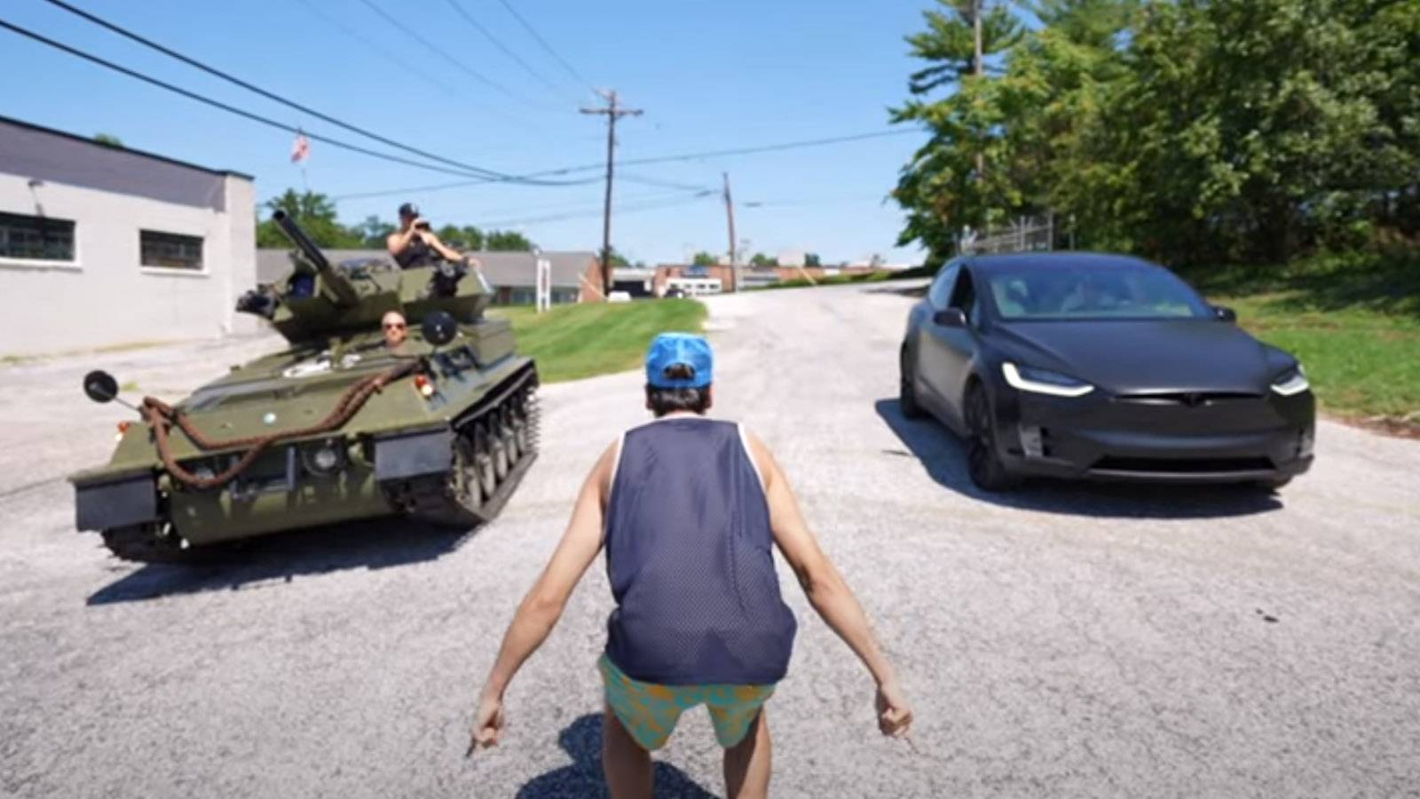 Military Tank Battles Tesla Model X In Drag Race And Tug Of War