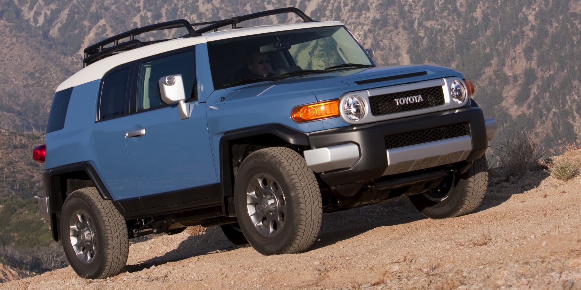 The front of a blue FJ Cruiser