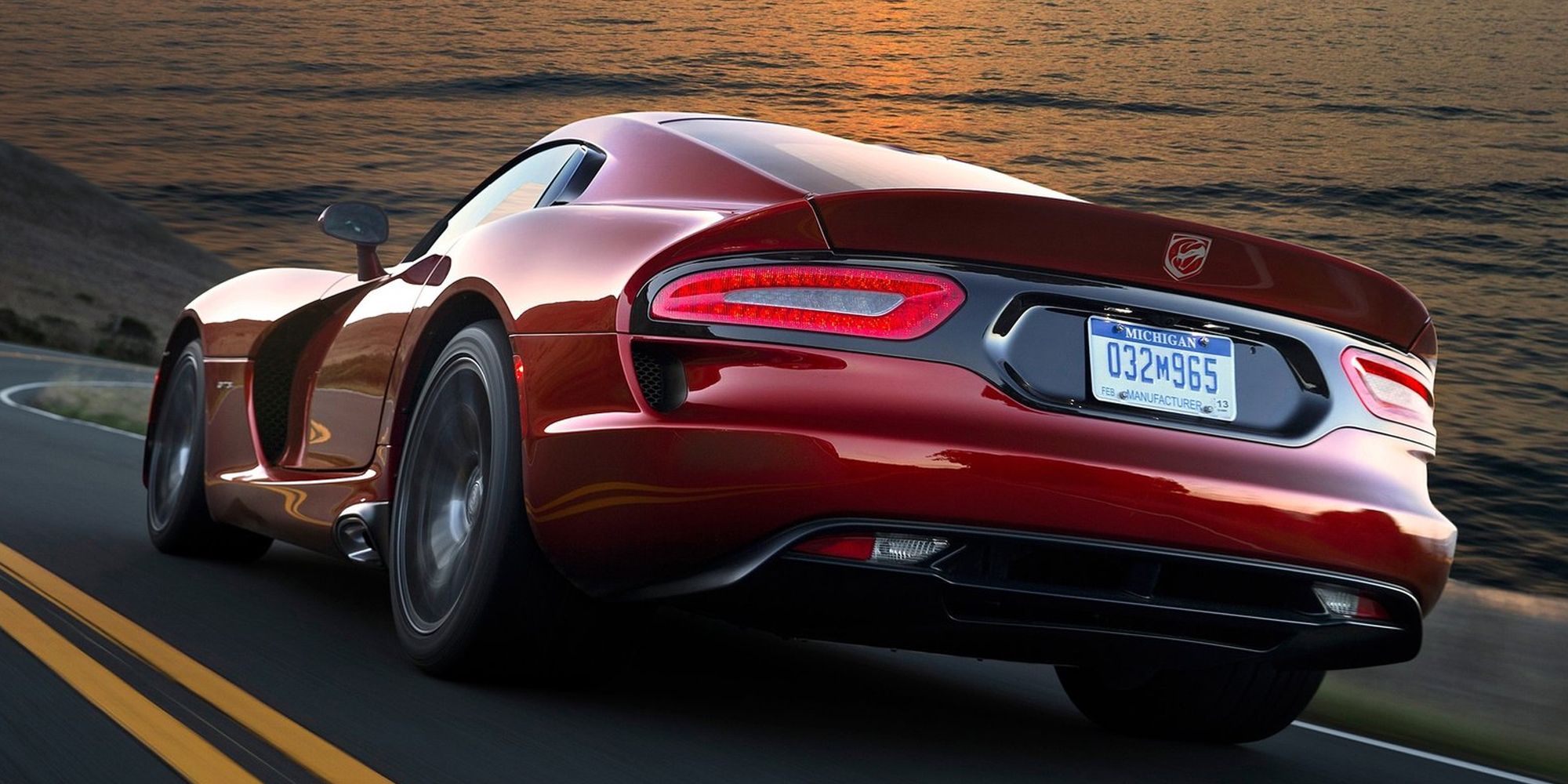 The rear of a red Viper GTS on the move