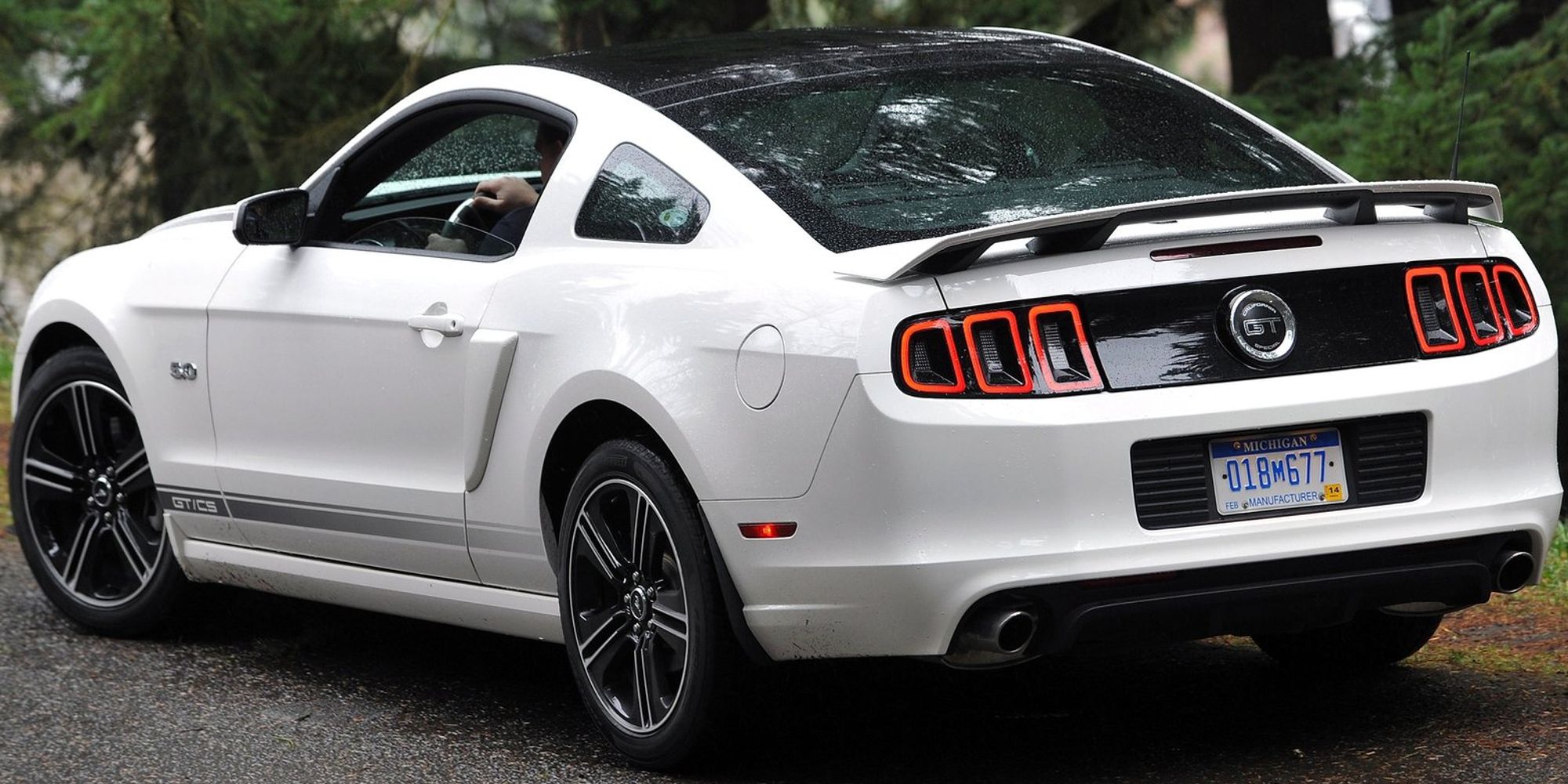 The rear of a white S197-II Mustang