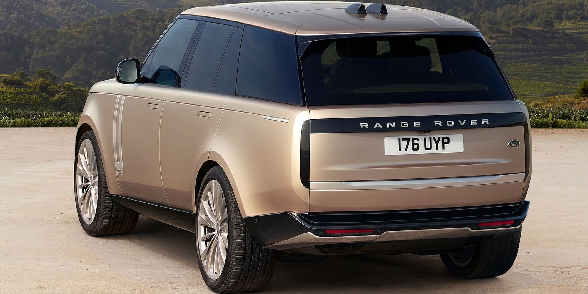 The rear of a gold Range Rover