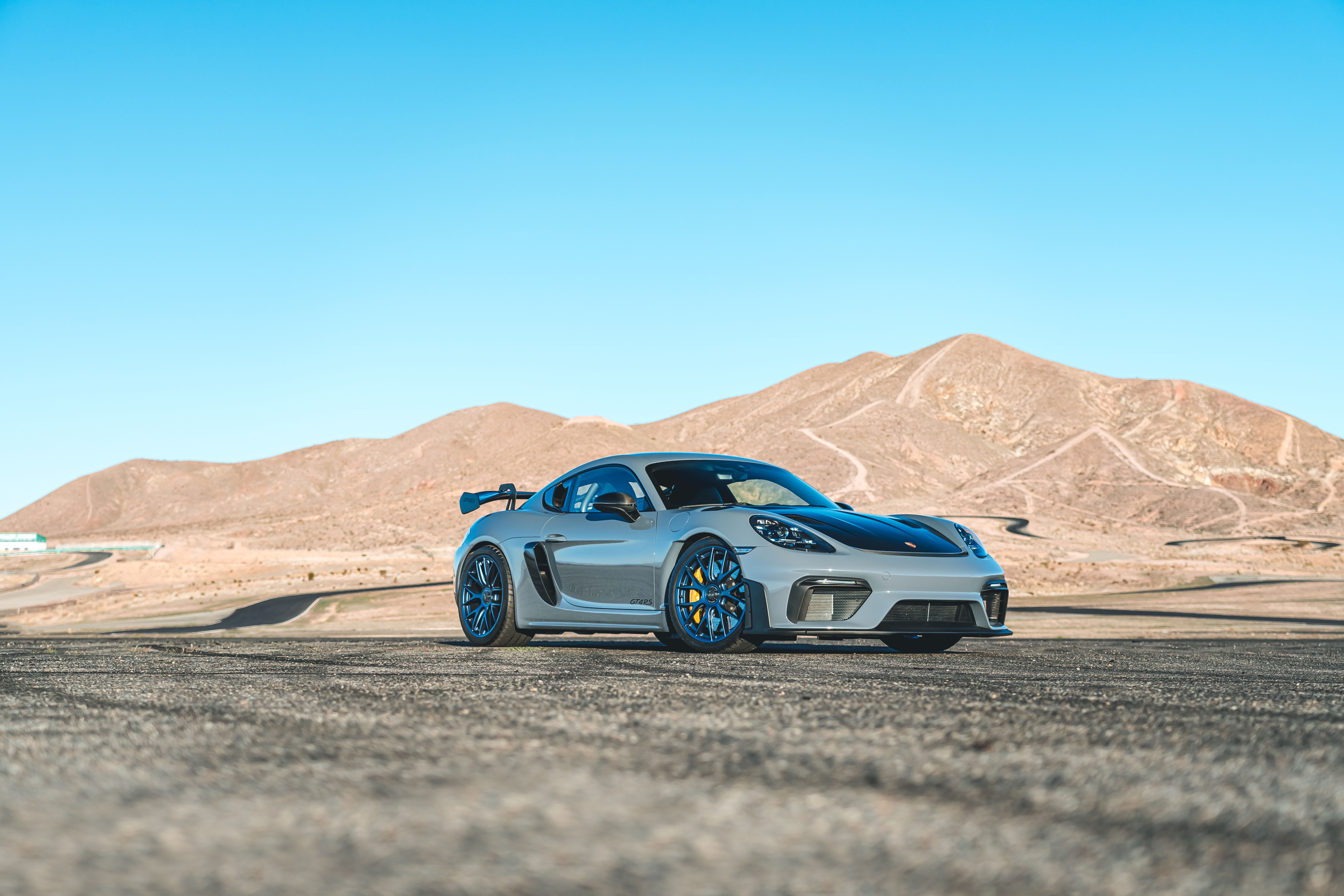 The Porsche Cayman GT4 RS parked on the track. 