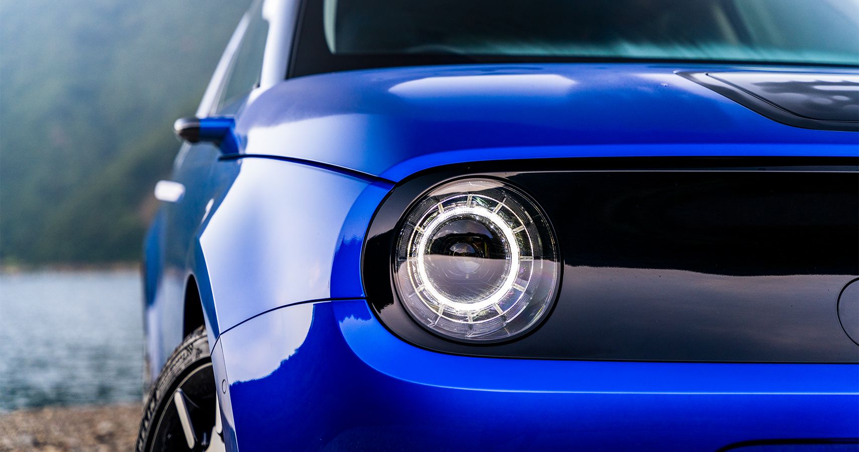 Blue Honda e headlights close-up