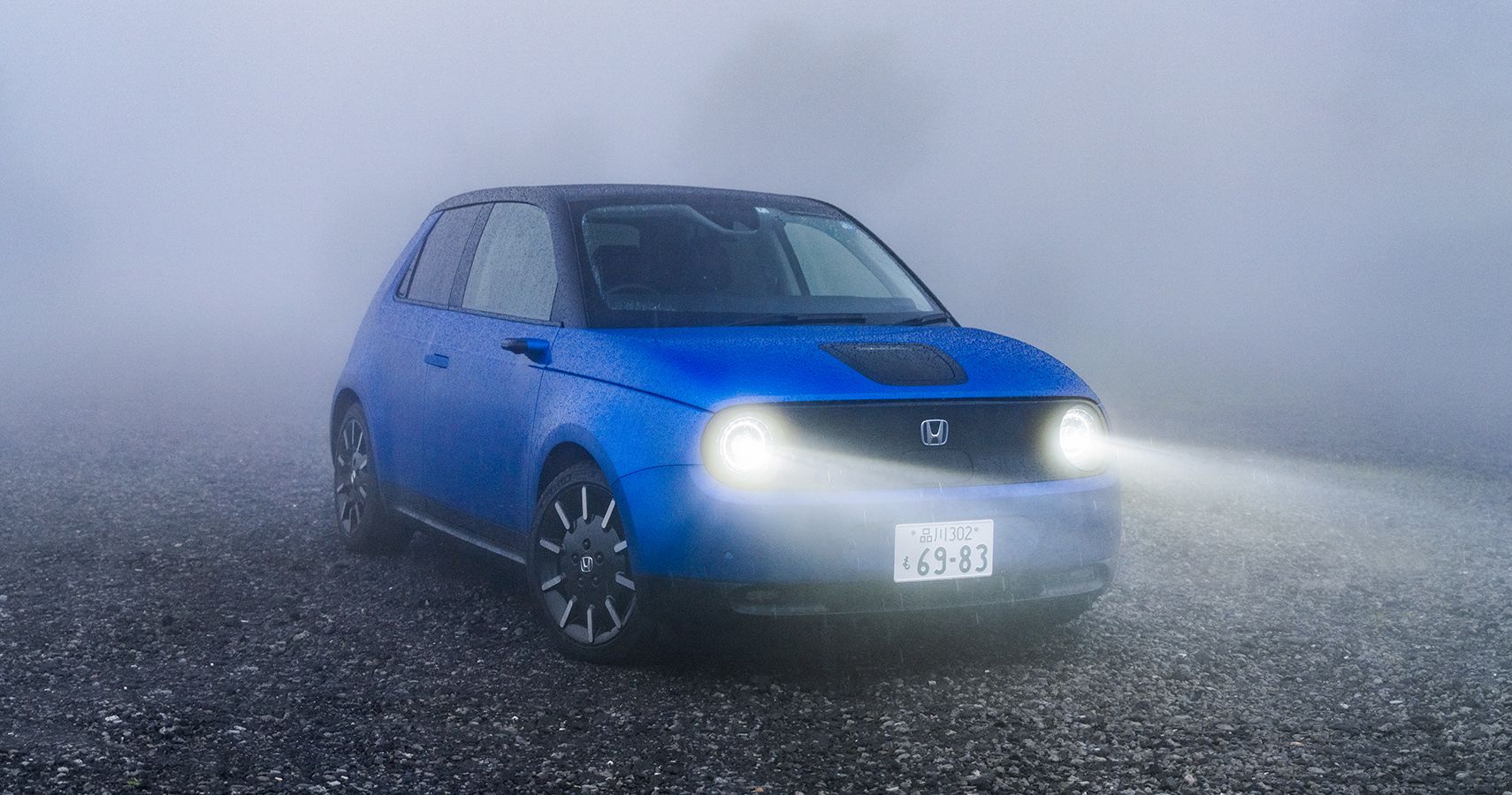 Front 3/4 Honda e in misty weather