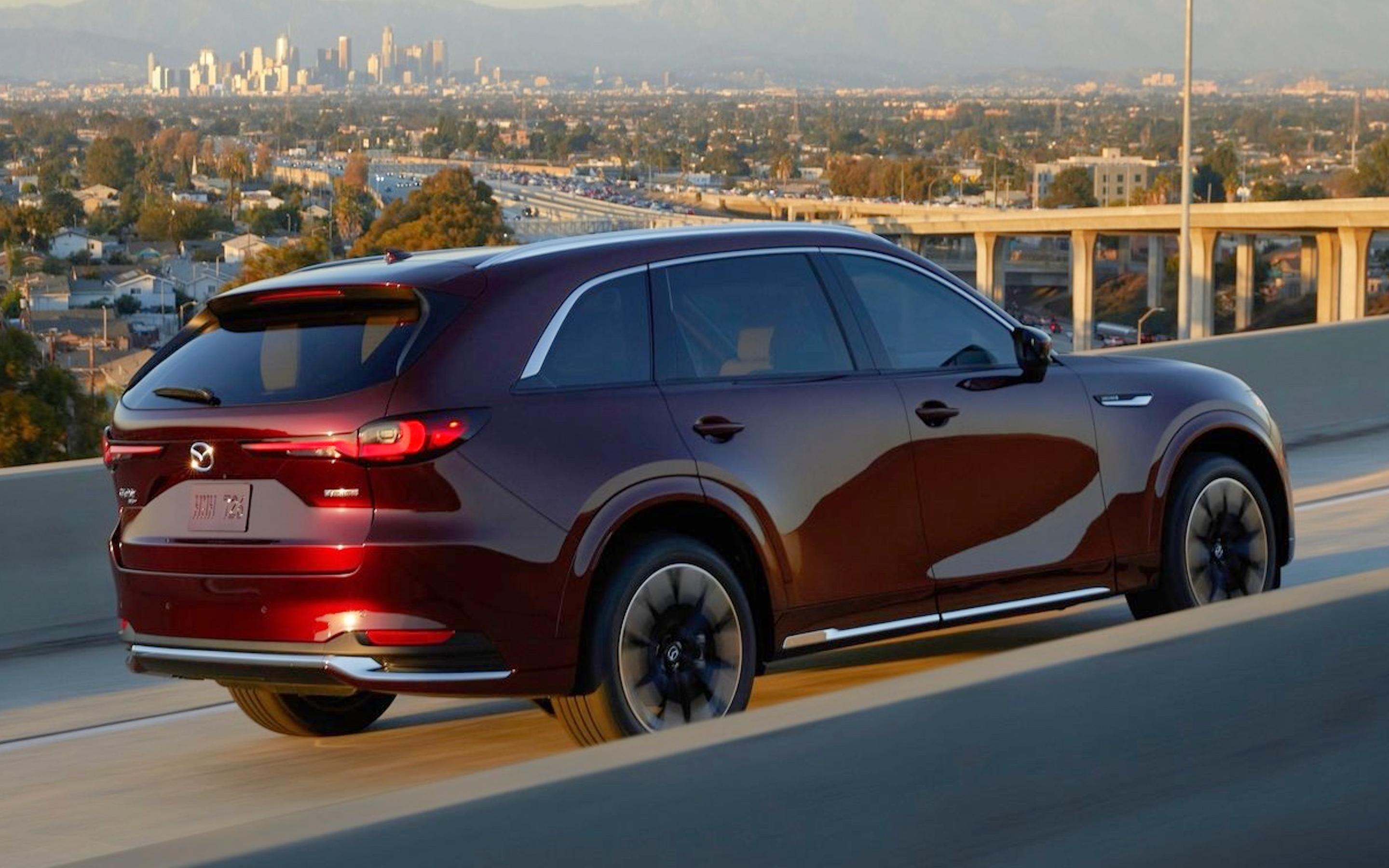 Rear view of the red 2024 Mazda CX-90