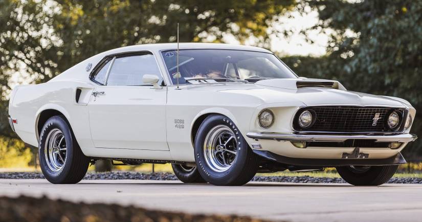 A white 1969 Ford Mustang Boss 429 parked