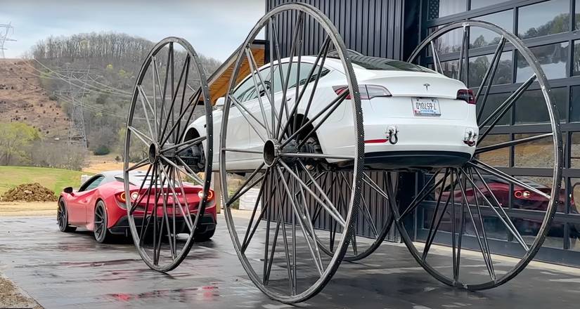 Watch This Strange Wagon-Wheeled Tesla Model 3 Drive Upside Down