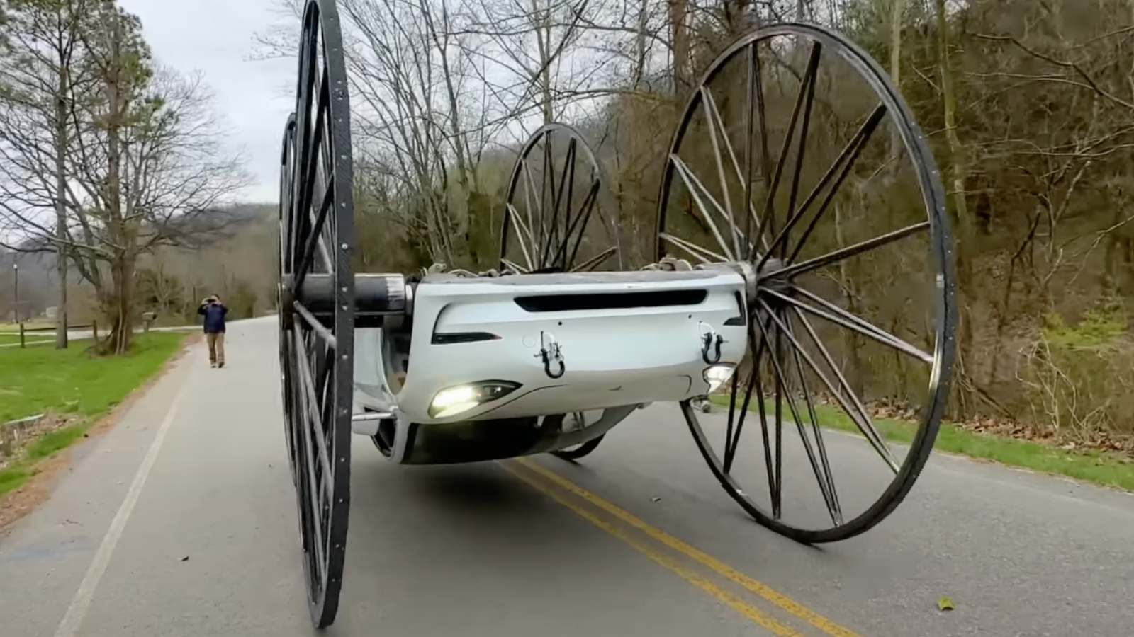 Watch This Strange Wagon-Wheeled Tesla Model 3 Drive Upside Down