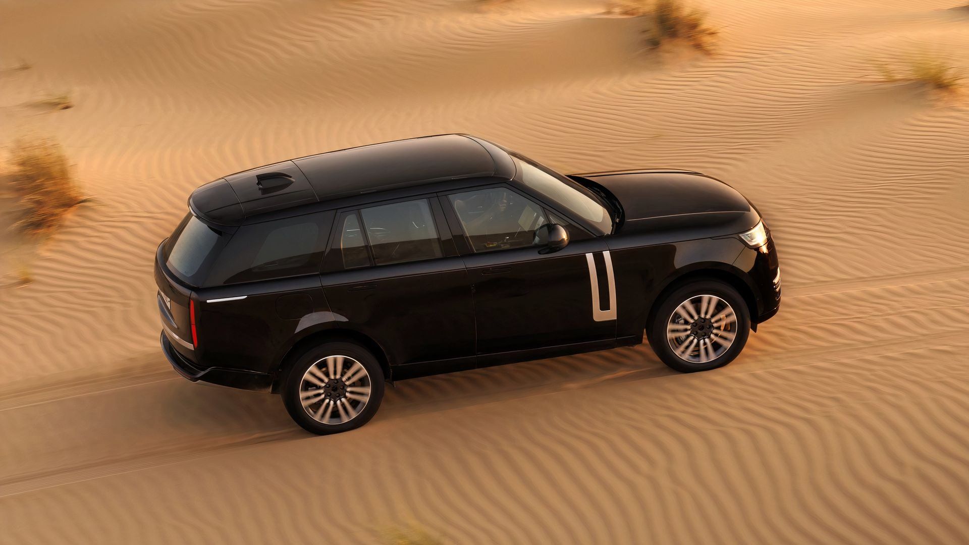 Land Rover Leaks Photos Of New Range Rover EV SUV Conquering The Sand ...