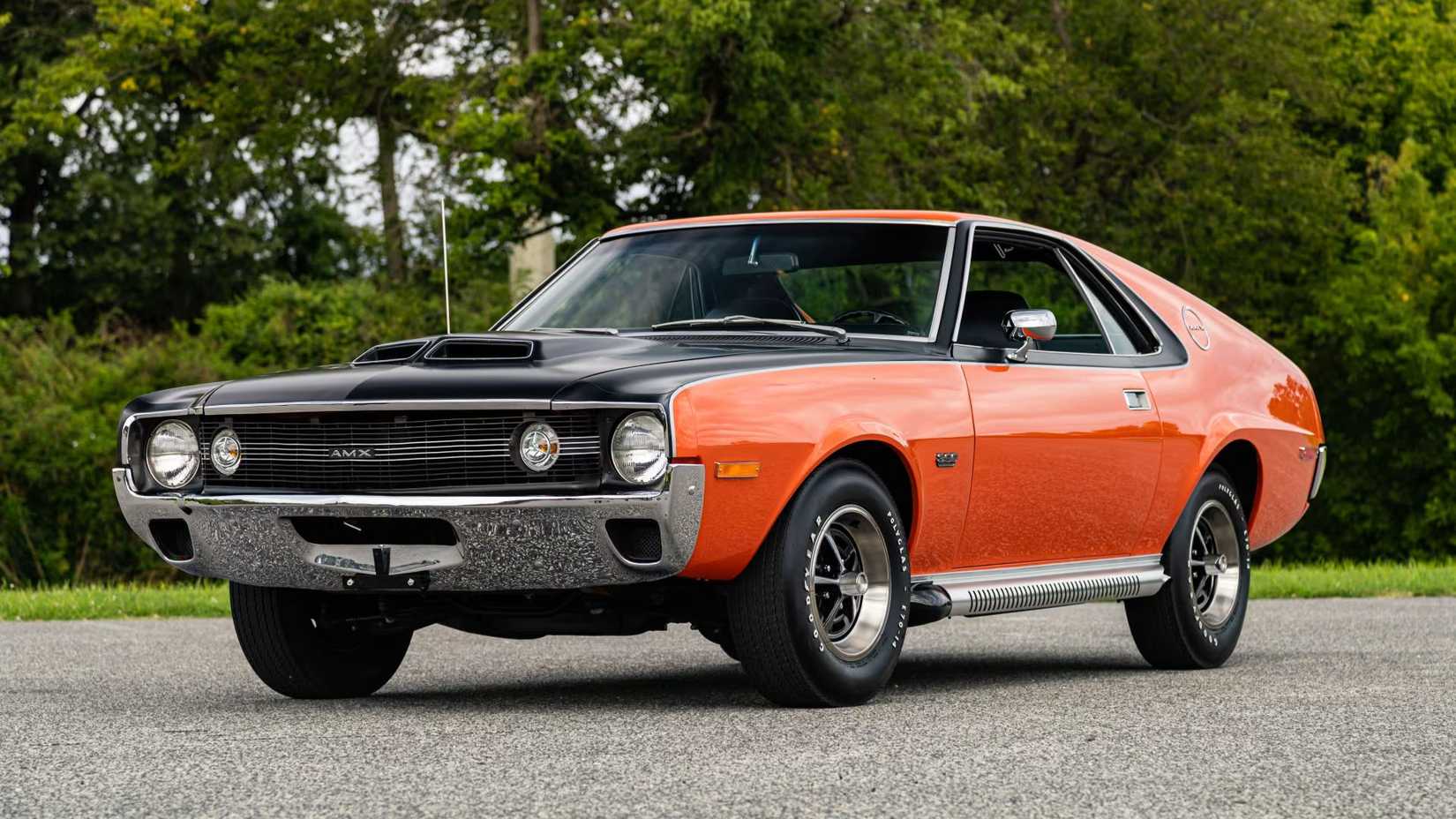 Front three-quarter shot of a parked 1970 AMC AMX finished in Big Bad Orange