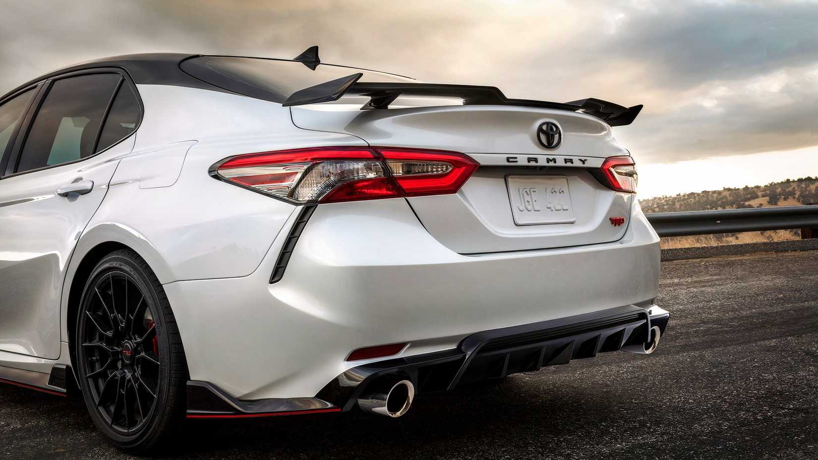 2020 Toyota Camry_TRDRear close-up three-quarter shot of a white Toyota Camry TRRear close-up three-quarter shot of a white Toyota Camry TRDD