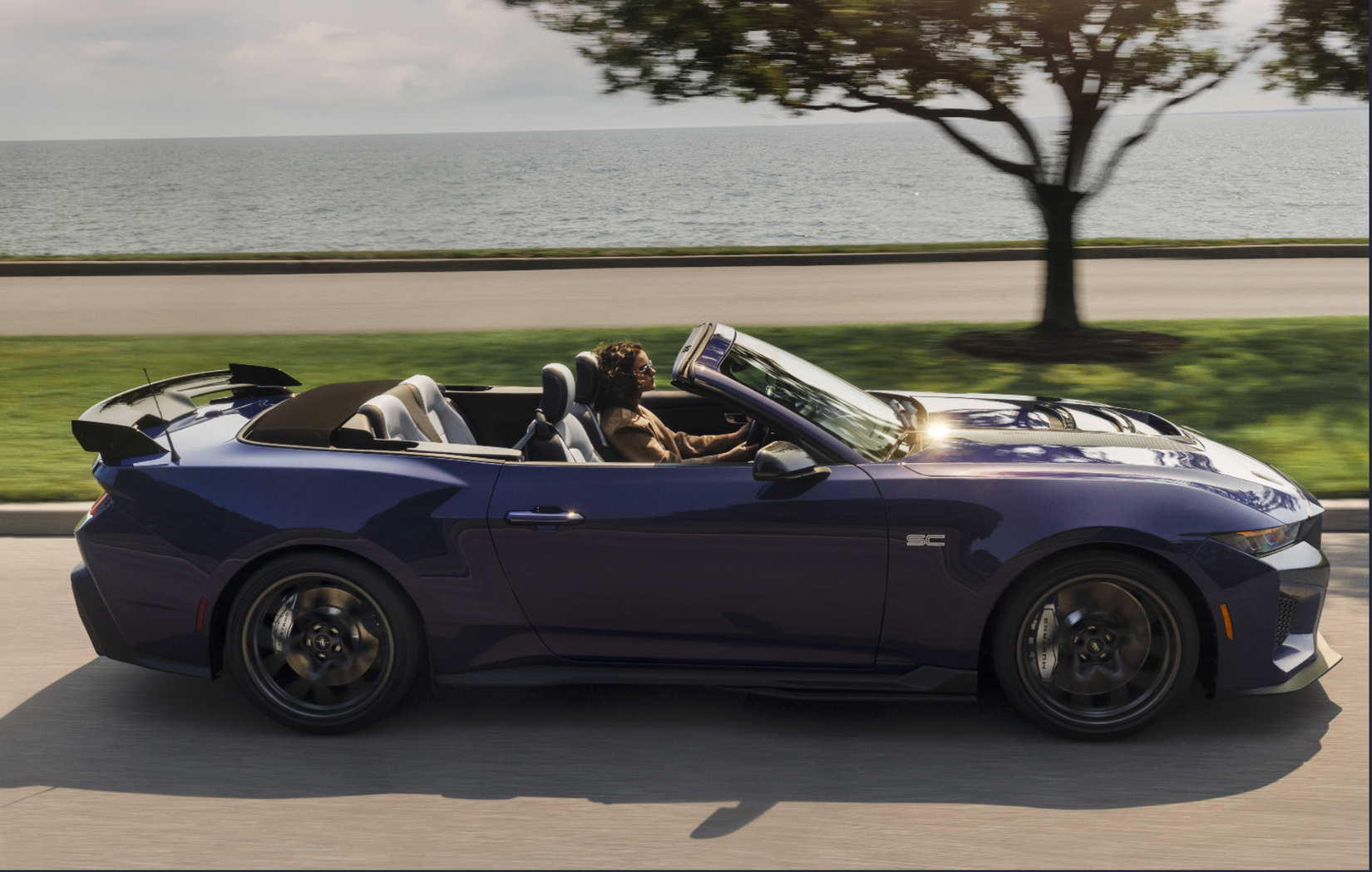 2027 Ford mustang dark horse sc convertible on the road